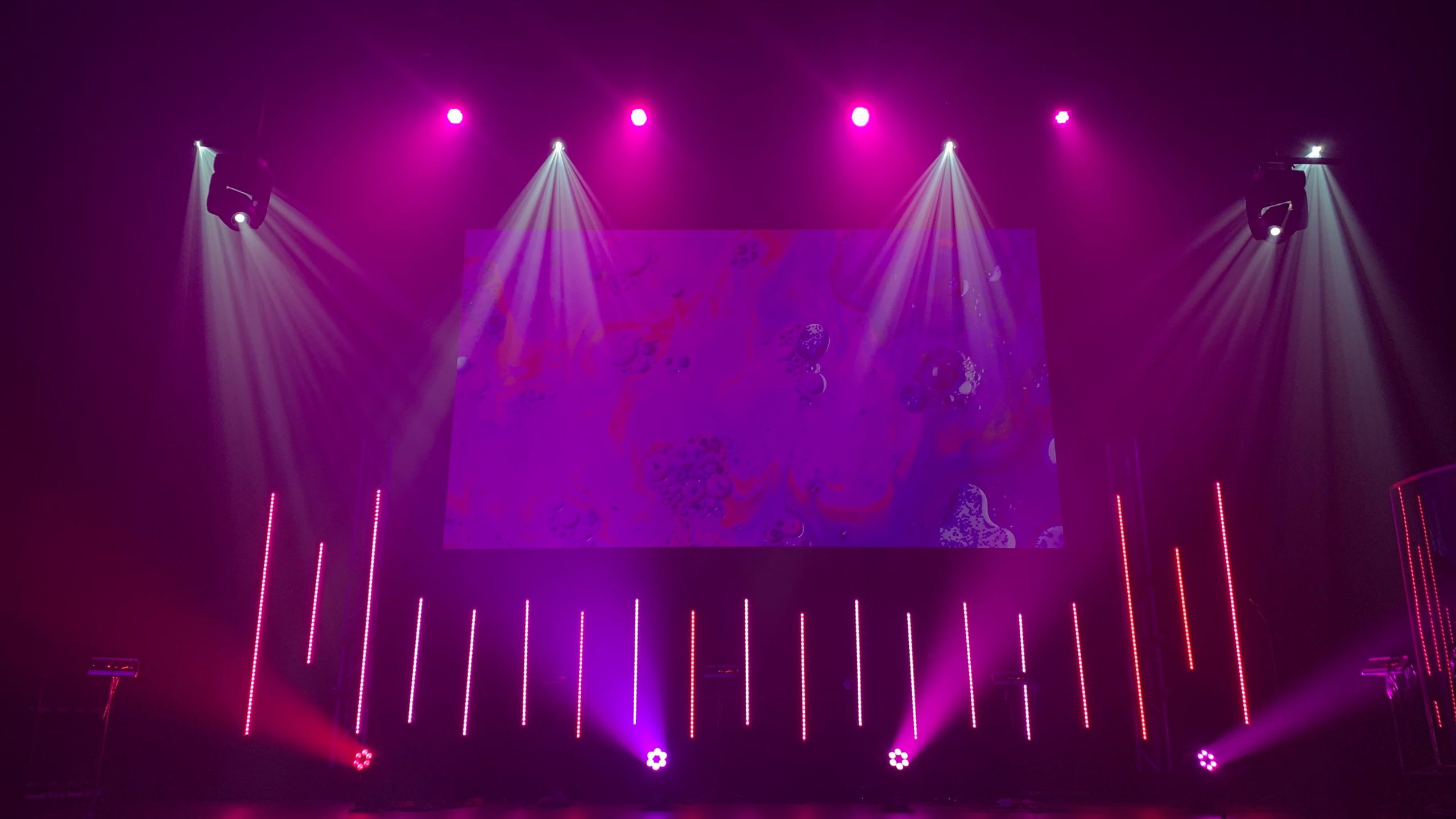 big stage with purple lights